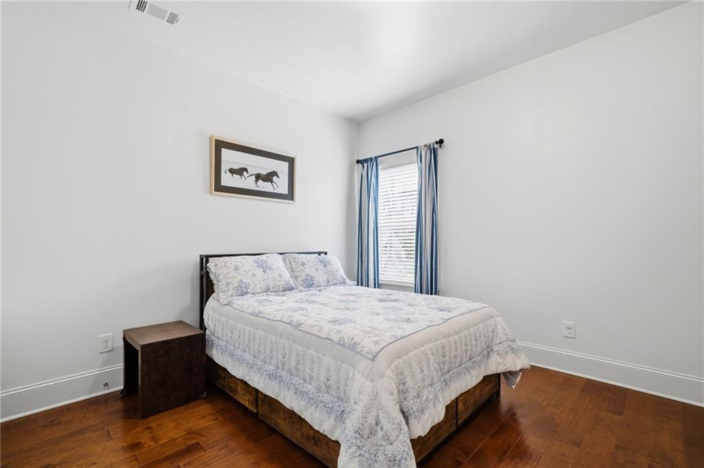 515 Sunset Street Canton, GA 30114 - Photo 36 of 64 a bed sitting in a spacious bedroom next to a window