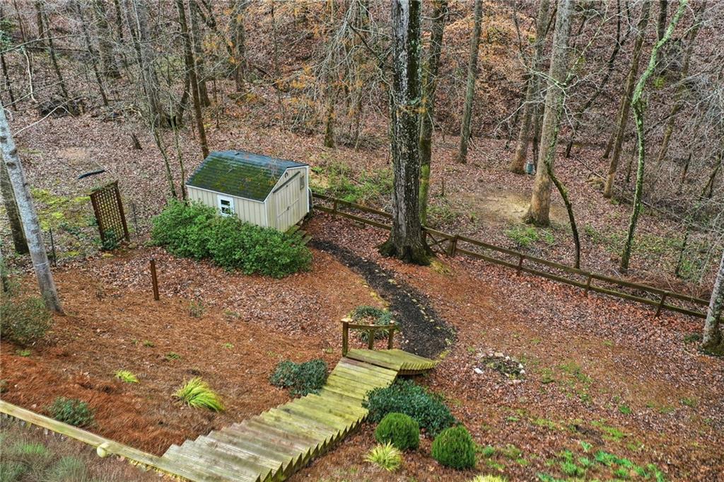 515 Sunset Street Canton, GA 30114 - Photo 45 of 64 a view of a backyard with large trees