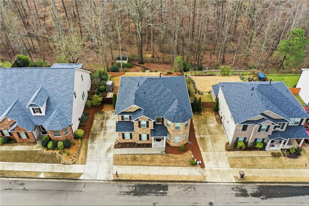 515 Sunset Street Canton, GA 30114 - Photo 49 of 64 an aerial view of residential houses with outdoor space and parking
