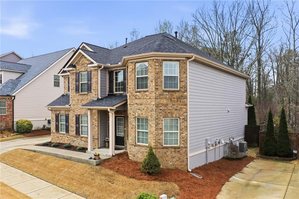 515 Sunset Street Canton, GA 30114 - Photo 51 of 64 a front view of a house with a yard