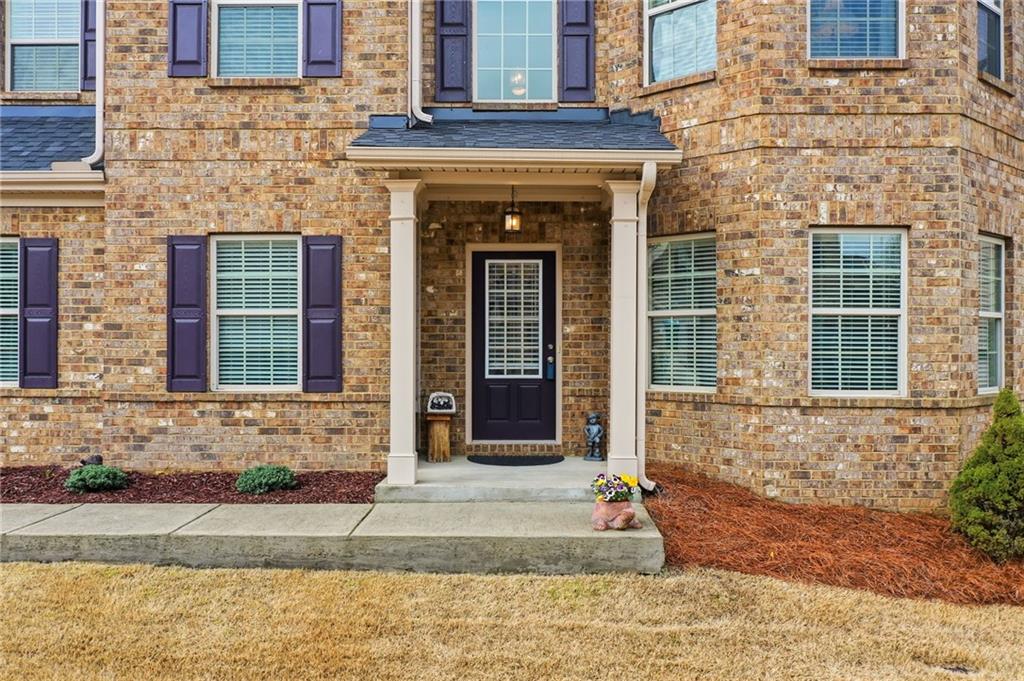 515 Sunset Street Canton, GA 30114 - Photo 53 of 64 a front view of a house with garden