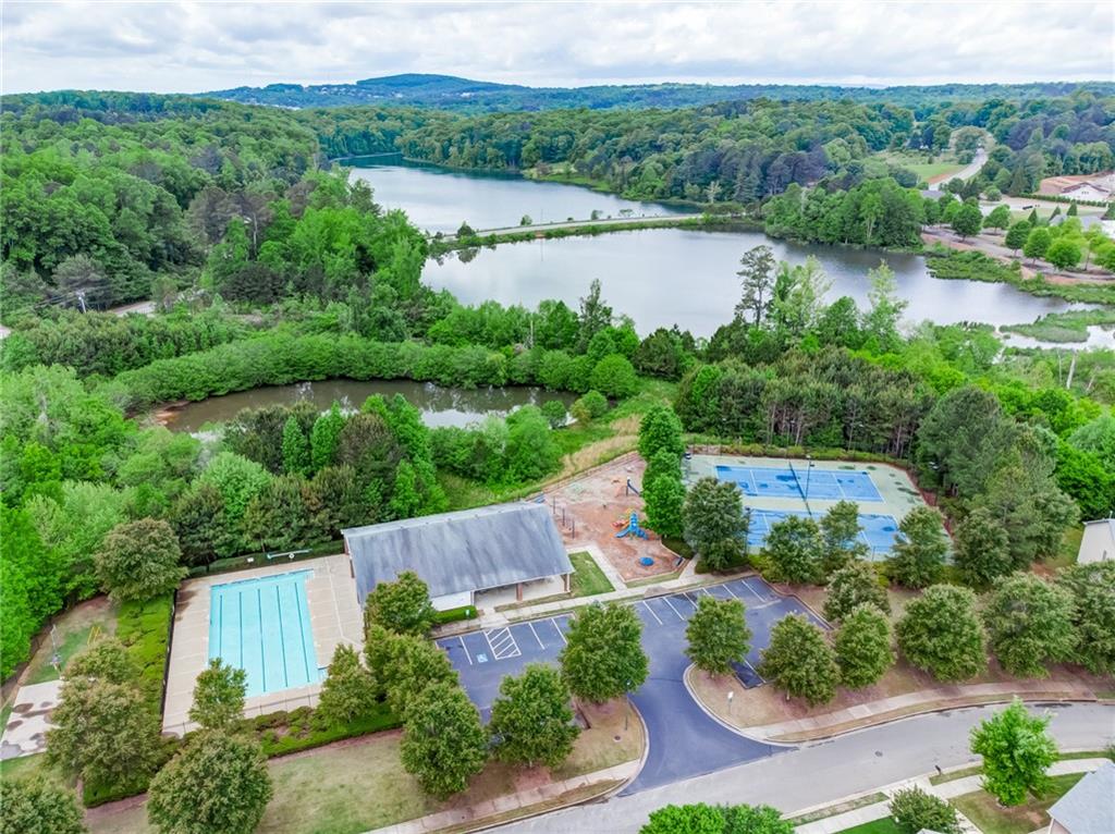 515 Sunset Street Canton, GA 30114 - Photo 61 of 64 an aerial view of green landscape with trees houses and lake view