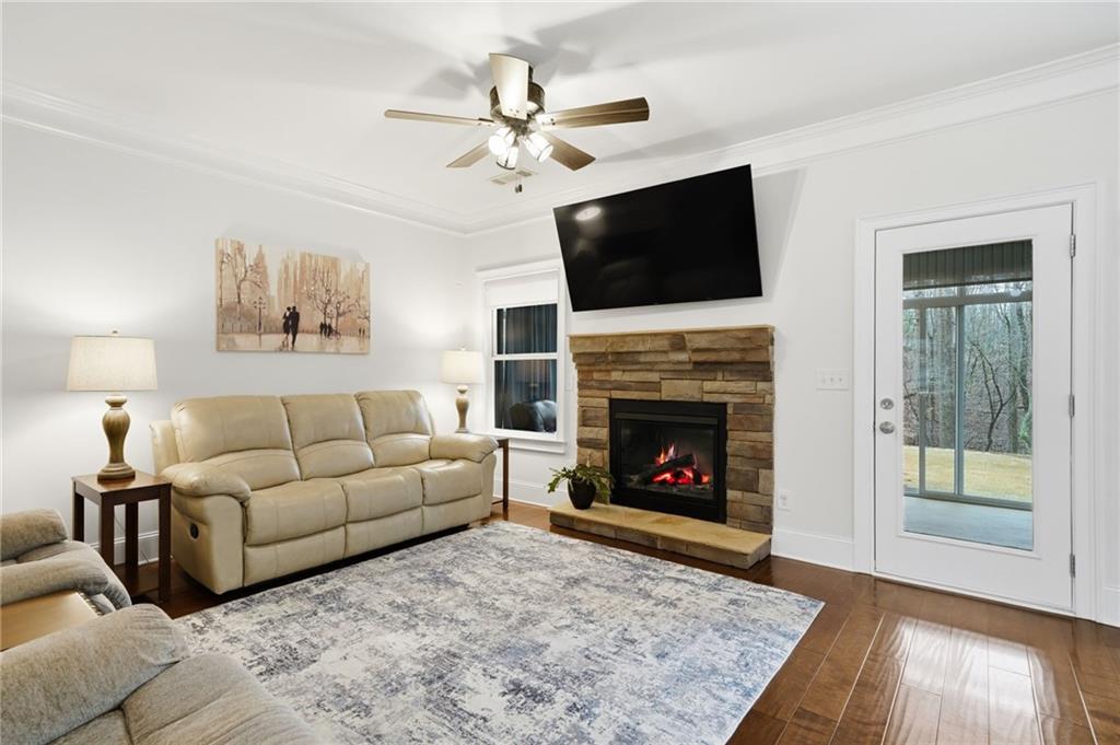 515 Sunset Street Canton, GA 30114 - Photo 7 of 64 a living room with furniture fireplace and flat screen tv