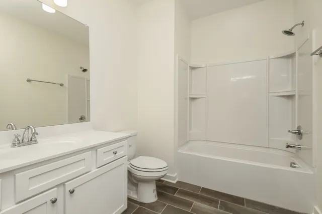 a bathroom with a toilet a sink and a bathtub
