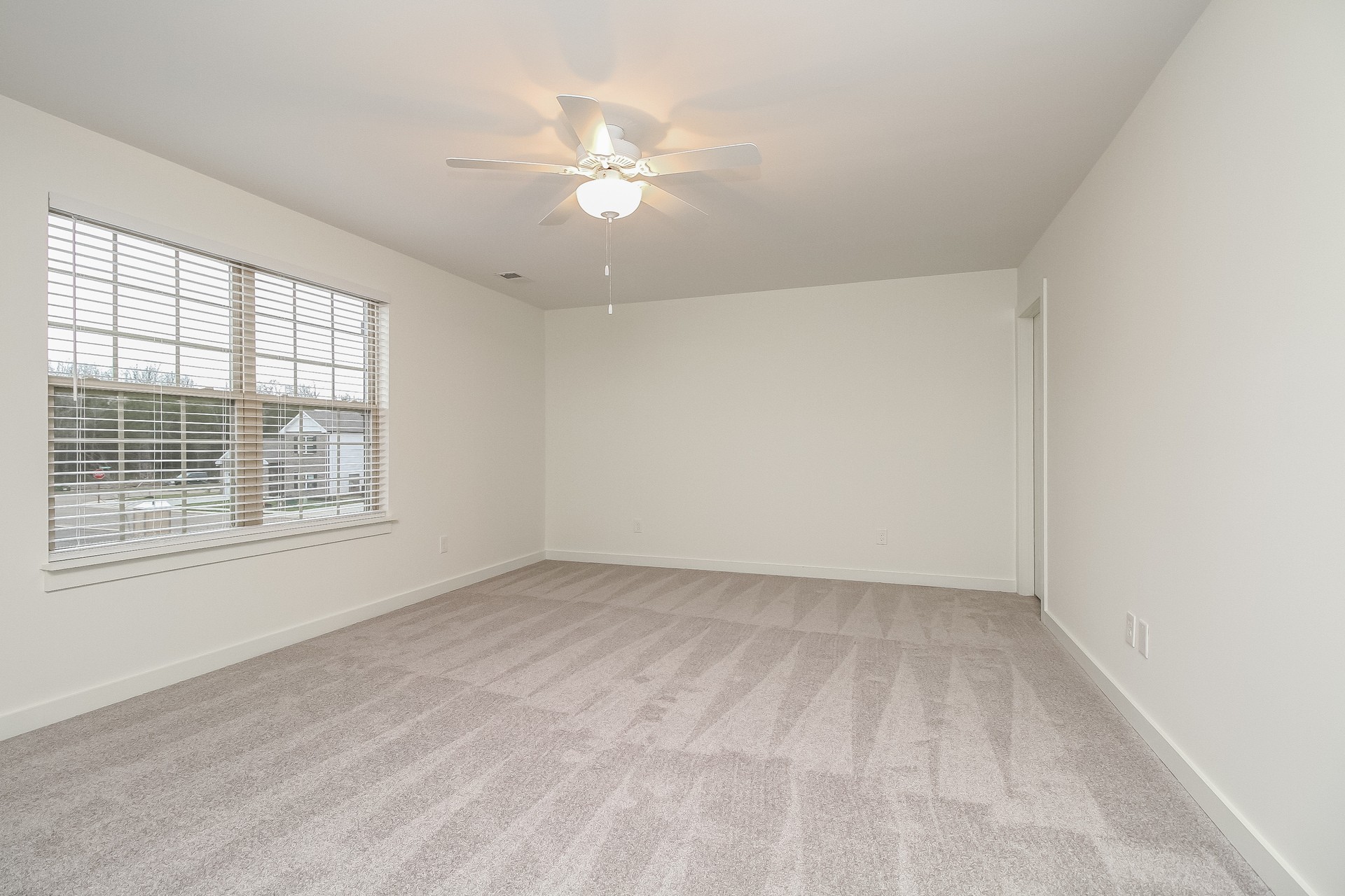4018 Ella Cook Circle Murfreesboro, TN 37129 - Photo 14 of 17 wooden floor in an empty room with a window