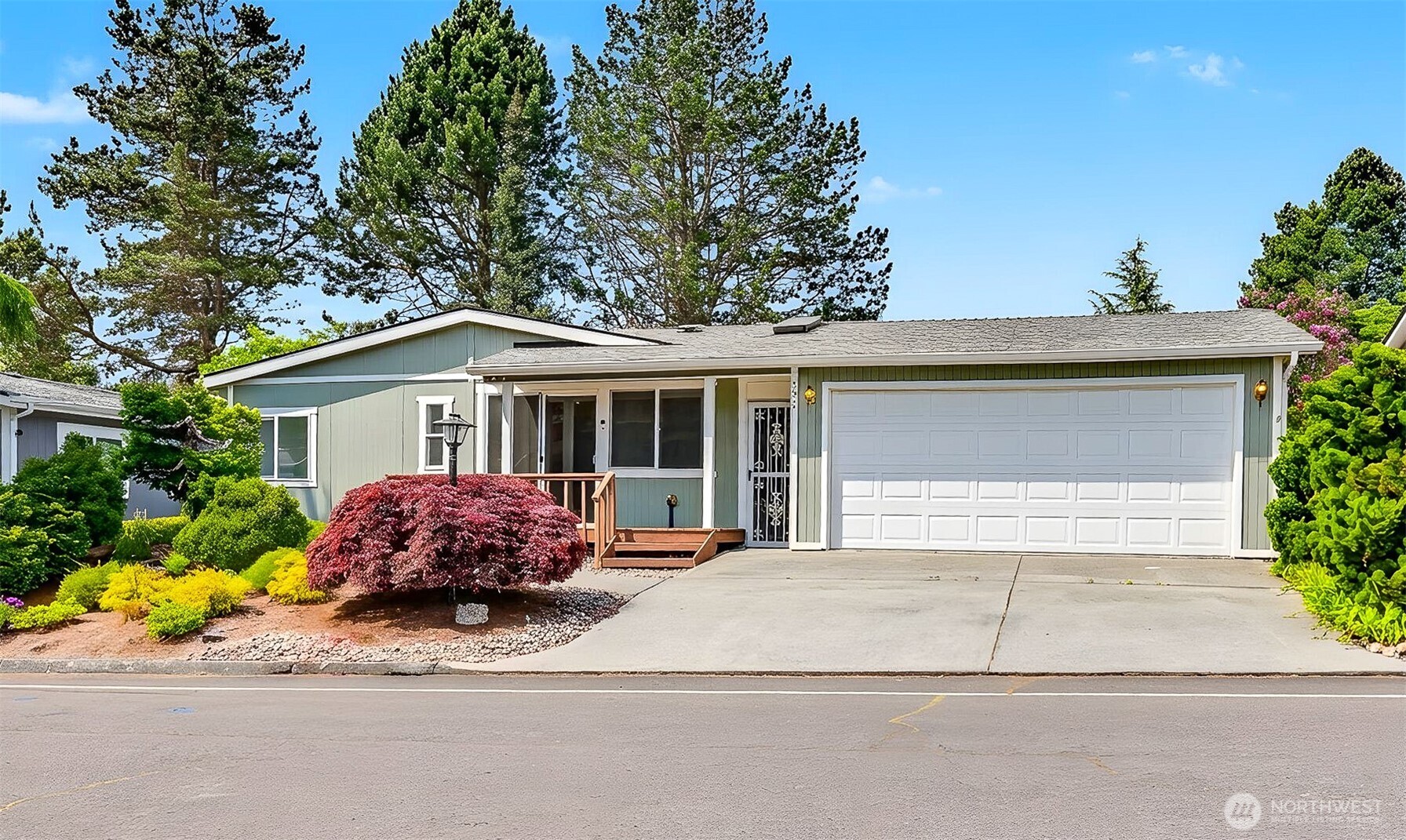 905 243rd Street Southwest Bothell, WA 98021 - Photo 34 of 37 a front view of a house with a yard and potted plants