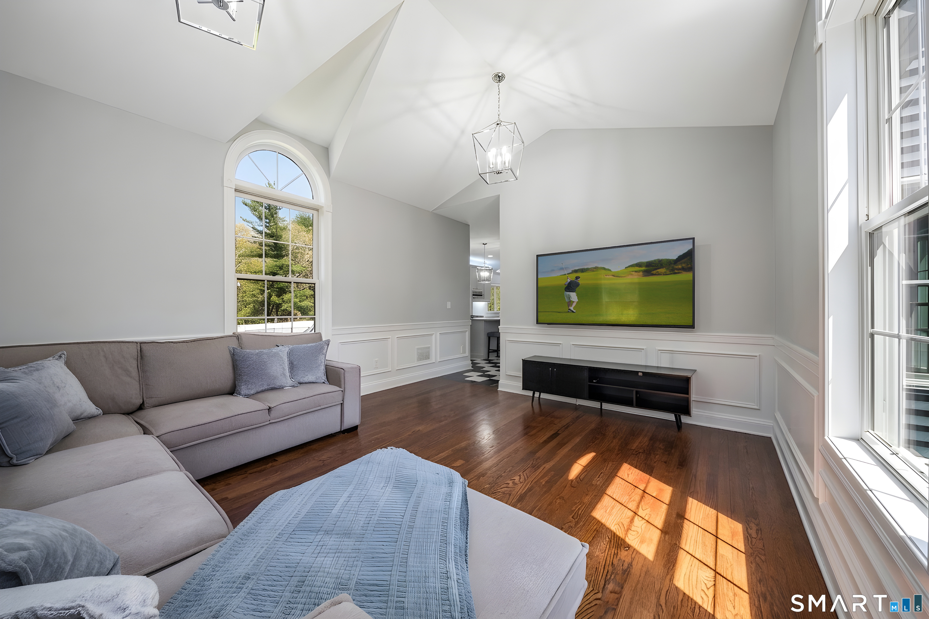 9 Sunset Ridge Drive Guilford, CT 06437 - Photo 14 of 40 a living room with furniture and a flat screen tv