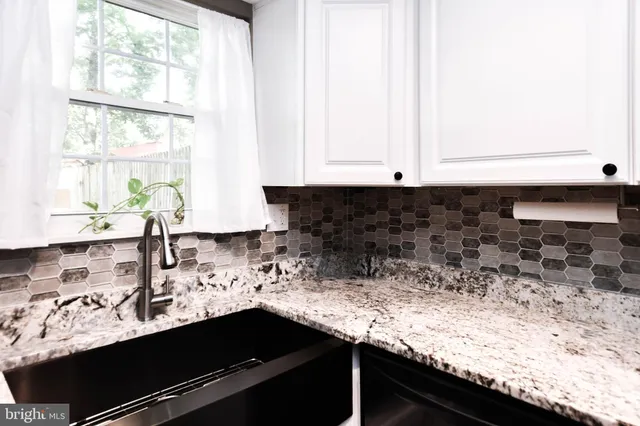 a kitchen with a sink and a window