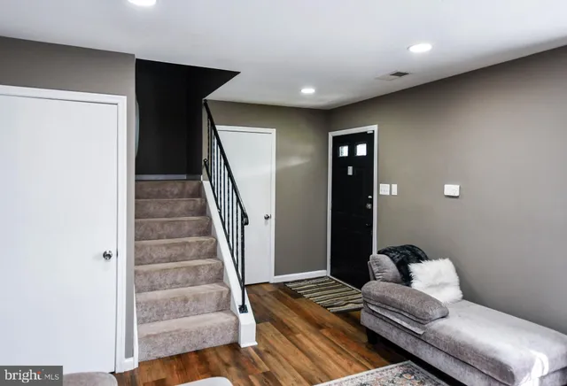 a view of livingroom with furniture and stairs