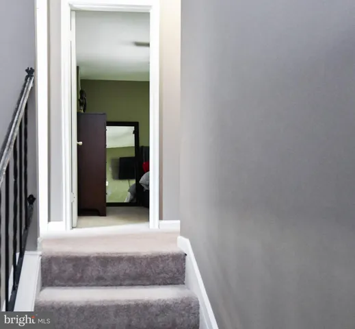 a view of a hallway view with staircase