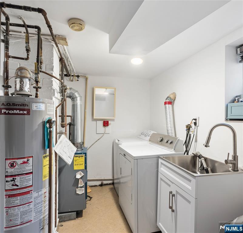 1675 Broad Street Bloomfield, NJ 07003 - Photo 23 of 35 a storage room with sink dryer and washer