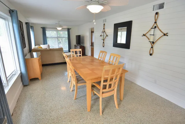a dining room with furniture and window