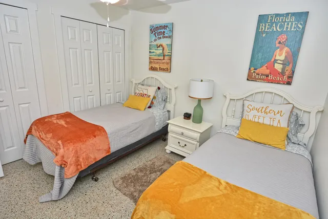 a bedroom with bed and cupboard