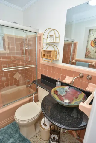 a bathroom with a toilet sink and bathtub