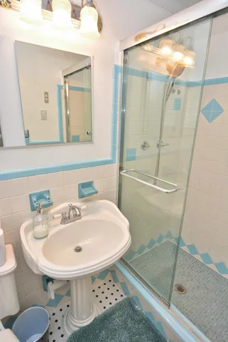 a bathroom with a sink and mirror