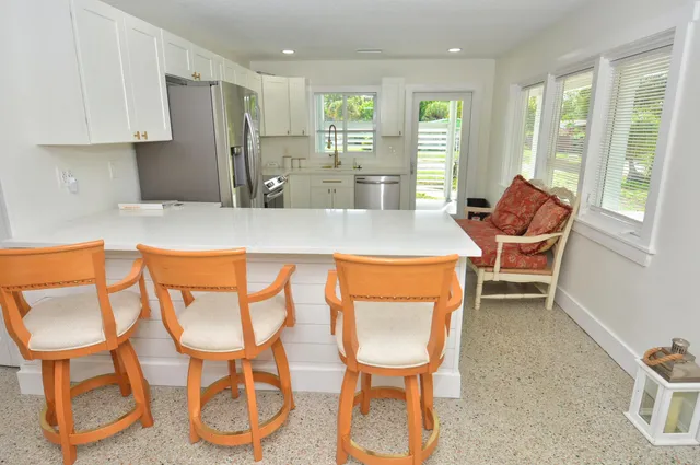 a dining room with chairs and a table