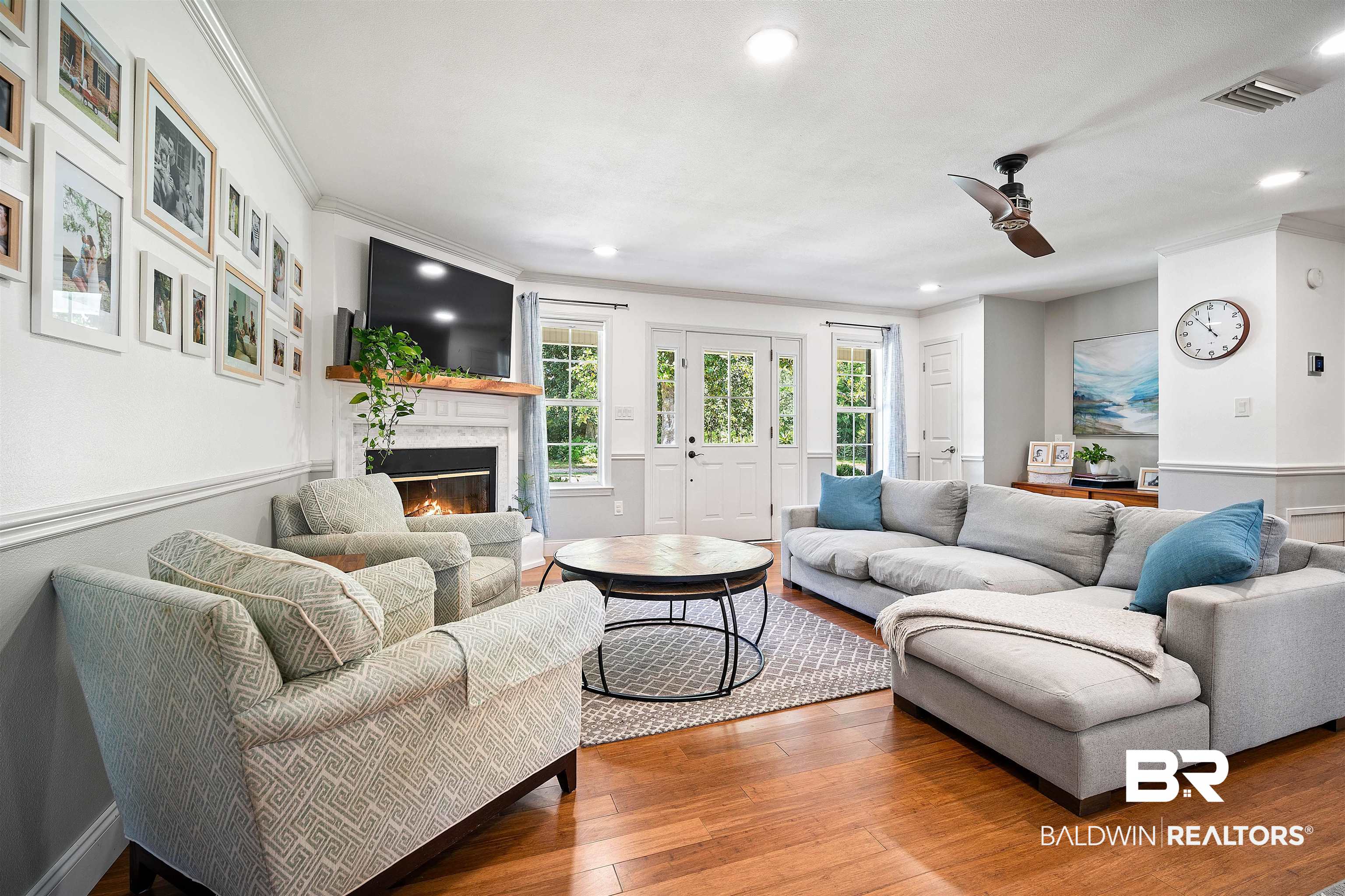 808 Michigan Avenue Fairhope, AL 36532 - Photo 7 of 33 Living room with a premium fireplace, hardwood / wood-style flooring, ceiling fan, and crown molding