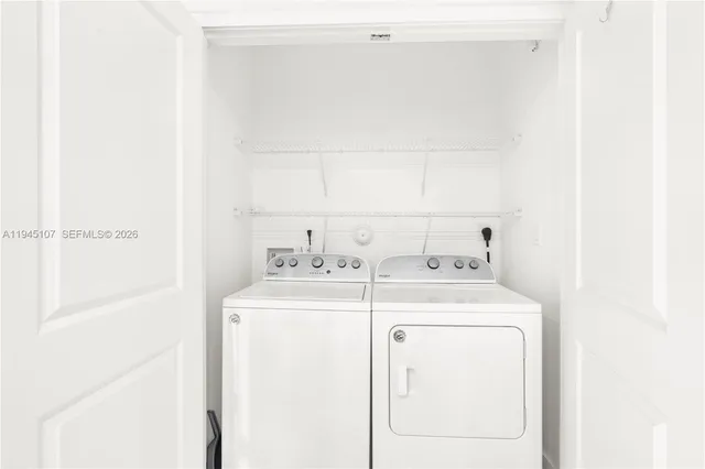 a utility room with dryer and washer