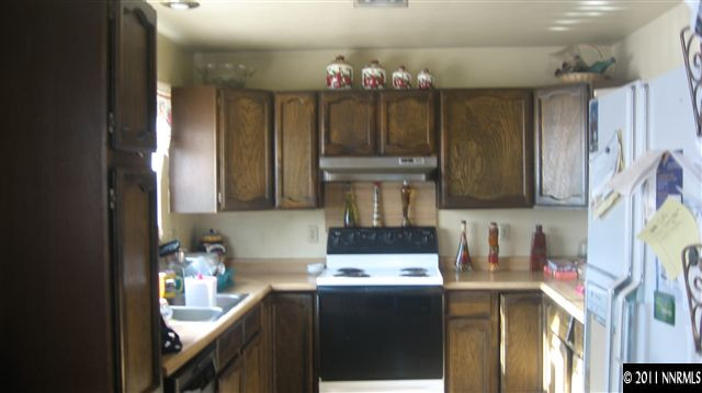 1465 Roberts Street Reno, NV 89502 - Photo 4 of 13 a kitchen with a sink cabinets and window