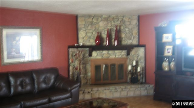 1465 Roberts Street Reno, NV 89502 - Photo 7 of 13 a living room with furniture and a fireplace