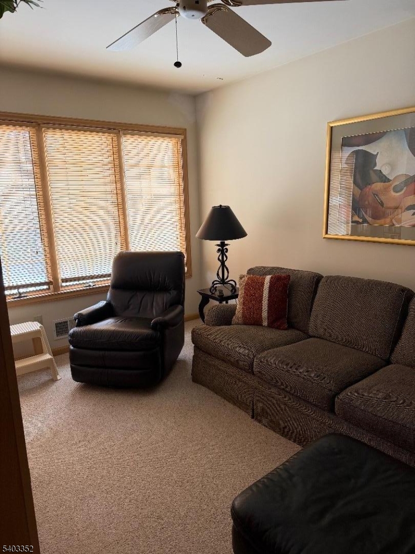 159 Wyoming Avenue Union, NJ 07083 - Photo 12 of 23 a living room with furniture and a large window