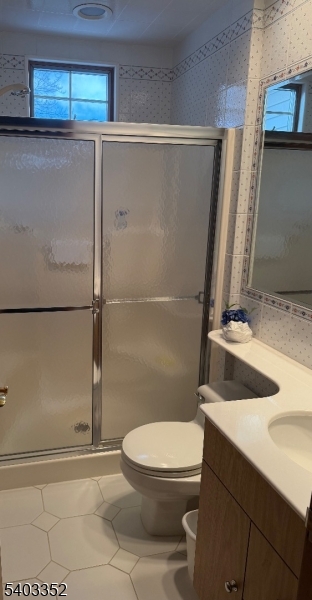 159 Wyoming Avenue Union, NJ 07083 - Photo 13 of 23 a white toilet sitting next to a bathroom sink