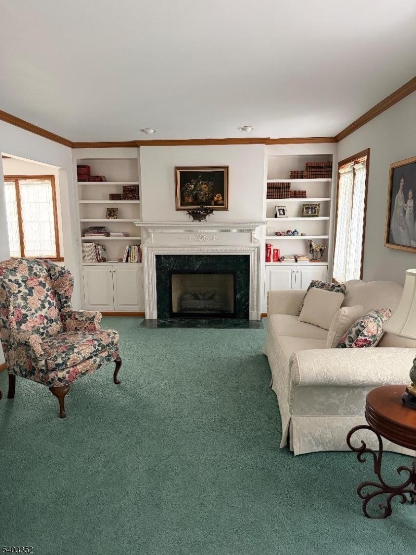 159 Wyoming Avenue Union, NJ 07083 - Photo 15 of 23 a living room with furniture and a fireplace
