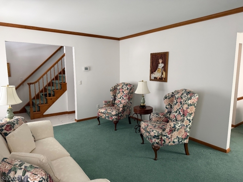 159 Wyoming Avenue Union, NJ 07083 - Photo 16 of 23 a living room with furniture chess board and stairs