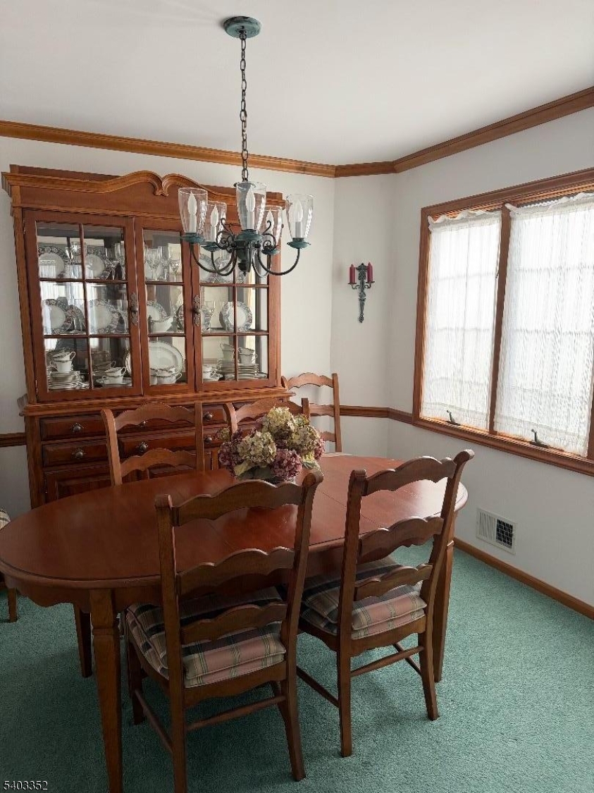 159 Wyoming Avenue Union, NJ 07083 - Photo 17 of 23 a view of a dining room with furniture window and outside view