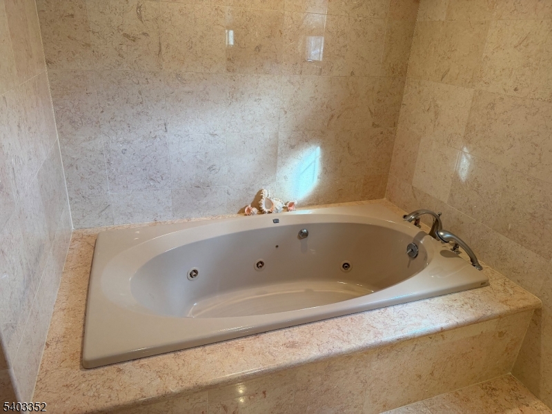 159 Wyoming Avenue Union, NJ 07083 - Photo 20 of 23 a bathroom with a tub and a sink