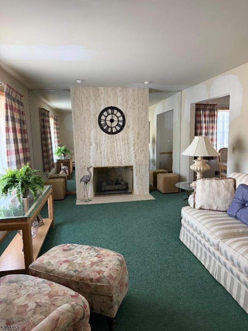 159 Wyoming Avenue Union, NJ 07083 - Photo 6 of 23 a living room with furniture and a fireplace