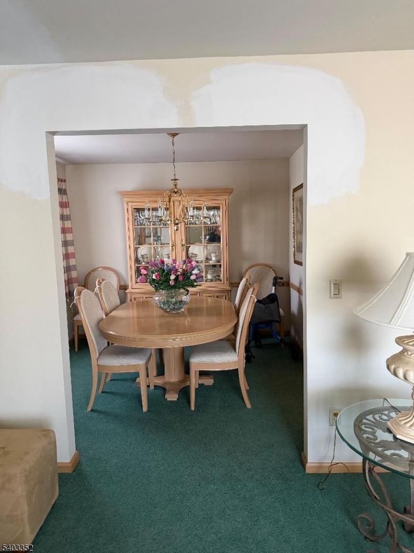 159 Wyoming Avenue Union, NJ 07083 - Photo 8 of 23 a dining room with furniture and chandelier