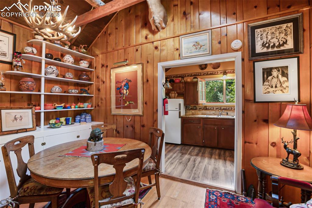 6015 Sioux Trail Cascade, CO 80809 - Photo 19 of 50 a view of a dining room with furniture and a potted plant