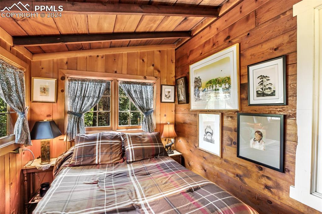 6015 Sioux Trail Cascade, CO 80809 - Photo 23 of 50 a view of a patio with table and chairs and wooden floor