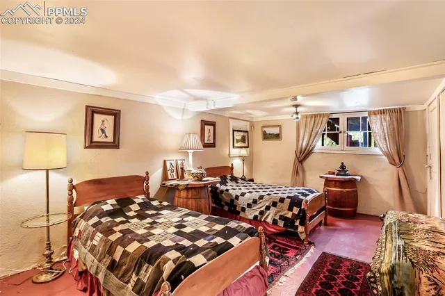 a bedroom with furniture and a wooden floor