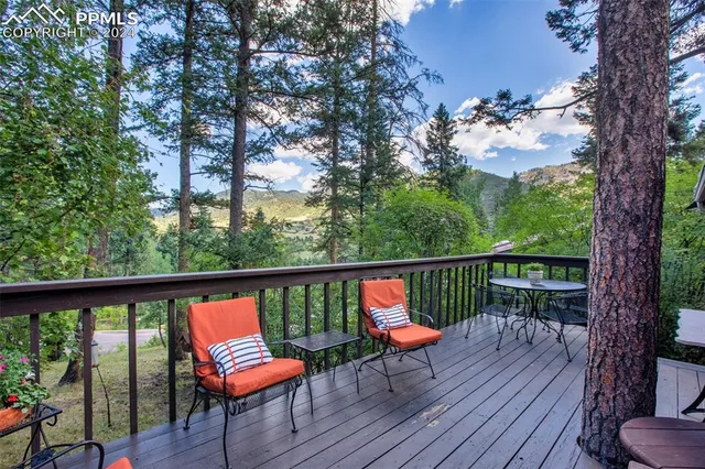 a view of a balcony with wooden floor