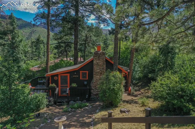 an aerial view of a house with a tree