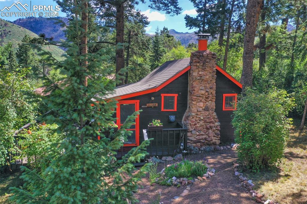 6015 Sioux Trail Cascade, CO 80809 - Photo 5 of 50 a front view of a house with garden