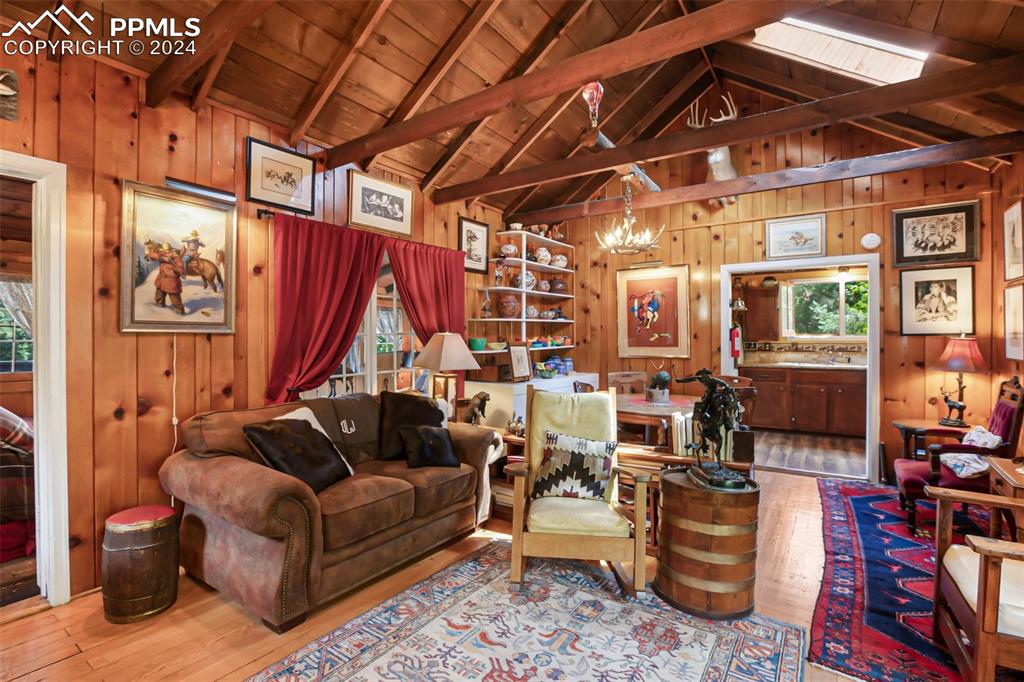 6015 Sioux Trail Cascade, CO 80809 - Photo 8 of 50 a living room with furniture and a chandelier