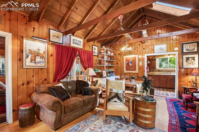 a living room with fireplace furniture and a fireplace