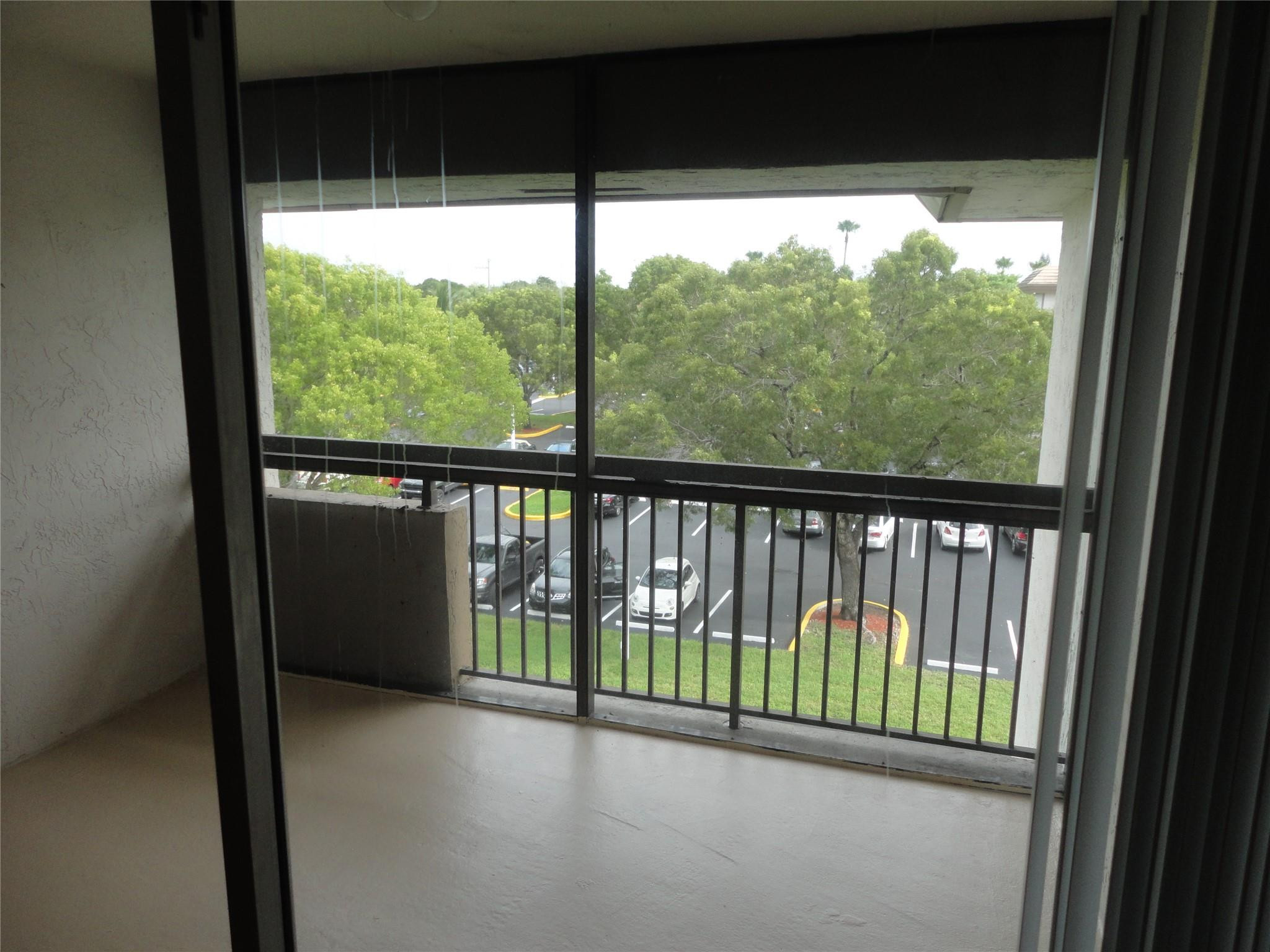 731 North Pine Island Road, Unit 402 Plantation, FL 33324 - Photo 11 of 11 a view of a balcony with an outdoor space