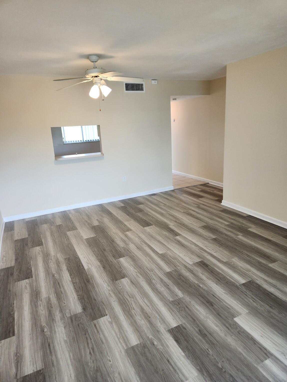 731 North Pine Island Road, Unit 402 Plantation, FL 33324 - Photo 3 of 11 a view of empty room with wooden floor