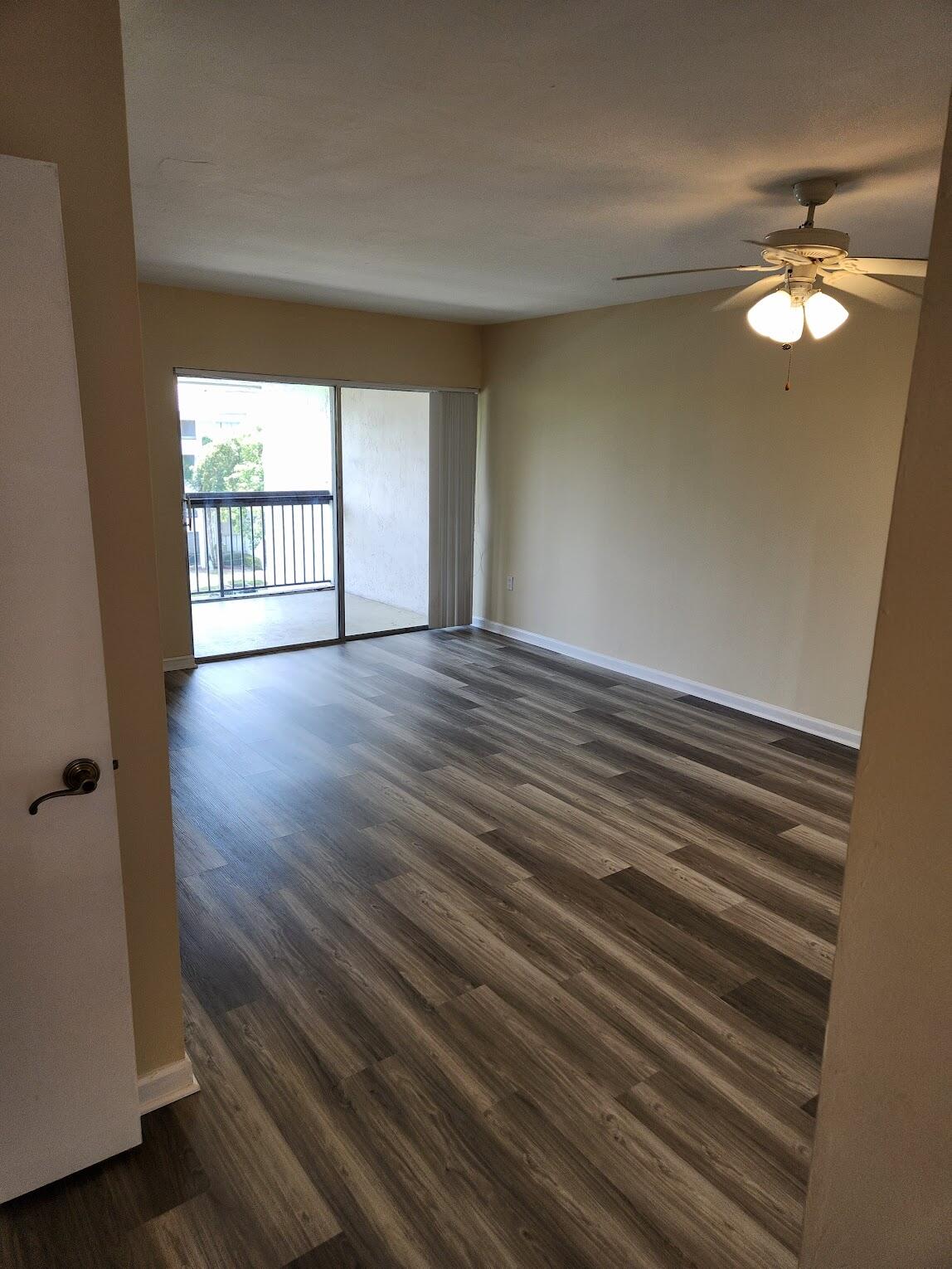 731 North Pine Island Road, Unit 402 Plantation, FL 33324 - Photo 4 of 11 wooden floor in an empty room with a window