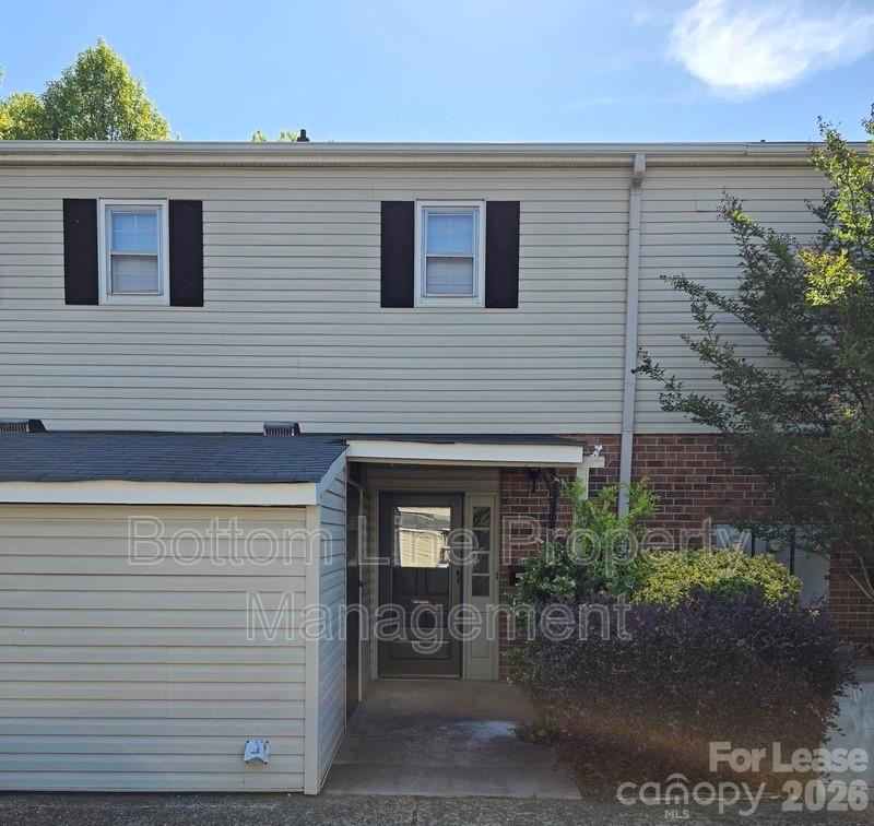 5949 Quail Hollow Road, Unit D Charlotte, NC 28210 - Photo 2 of 34 a view of a house with patio