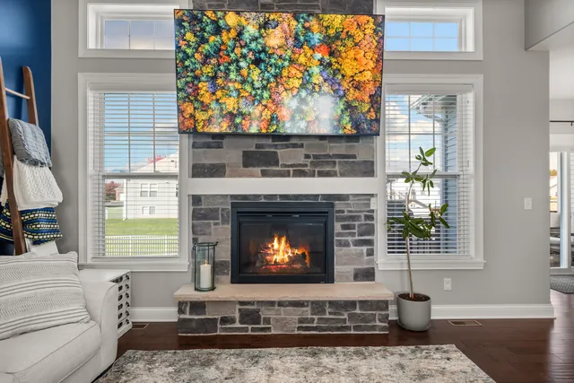 a living room with furniture and a view of kitchen