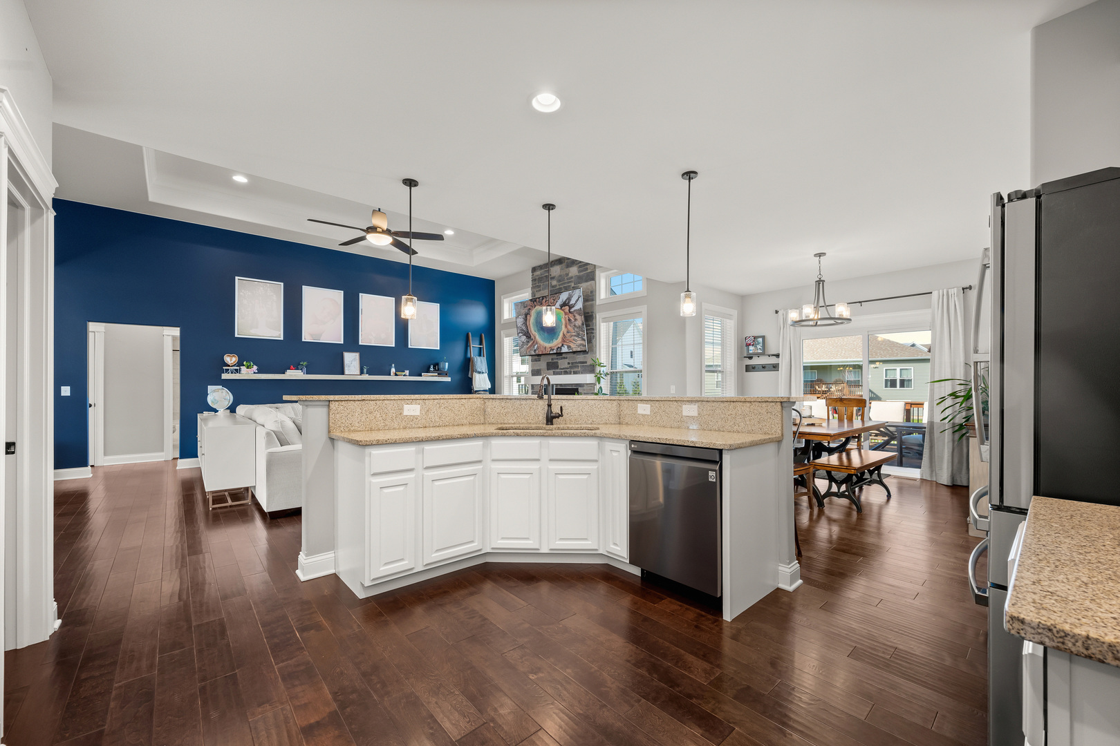 1435 Beach Lane Sycamore, IL 60178 - Photo 19 of 39 a kitchen with stainless steel appliances kitchen island granite countertop a stove top oven a sink a dining table and chairs