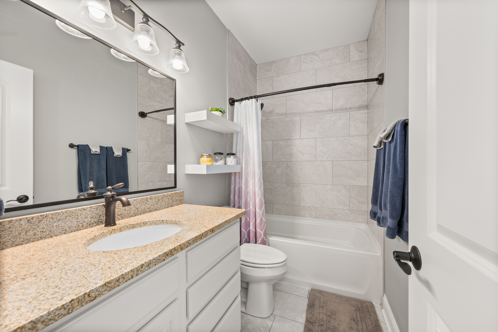 1435 Beach Lane Sycamore, IL 60178 - Photo 31 of 39 a bathroom with a granite countertop sink toilet and shower