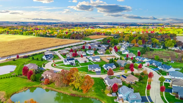 a view of a balcony with wooden floor and outdoor seating