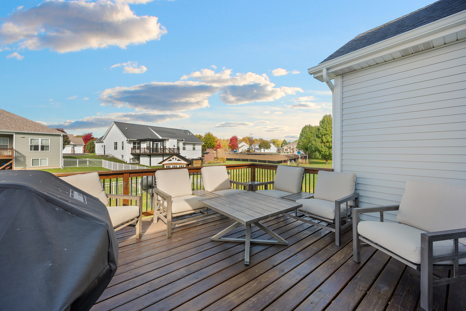 1435 Beach Lane Sycamore, IL 60178 - Photo 9 of 39 a view of a balcony with wooden floor and outdoor seating
