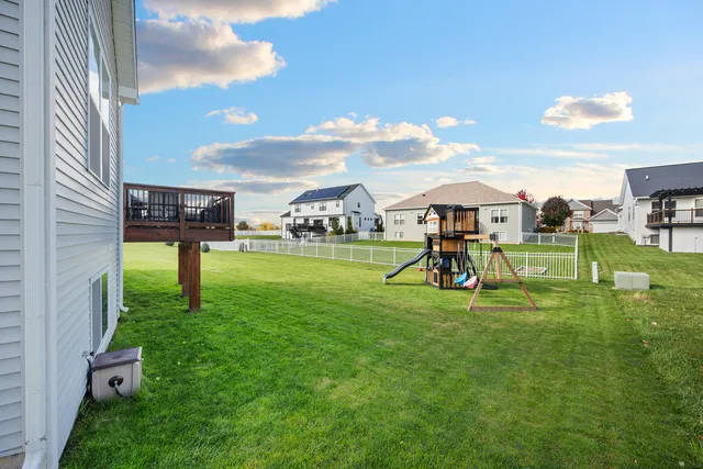 a view of an house with backyard space and garden